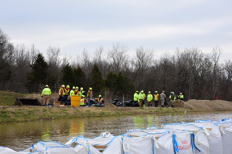 Combat Engineers with the 220th, 880th and 1138th Engineering Companies fill sandbags supporting Missouri Department of Transportation workers in Arnold, Mo