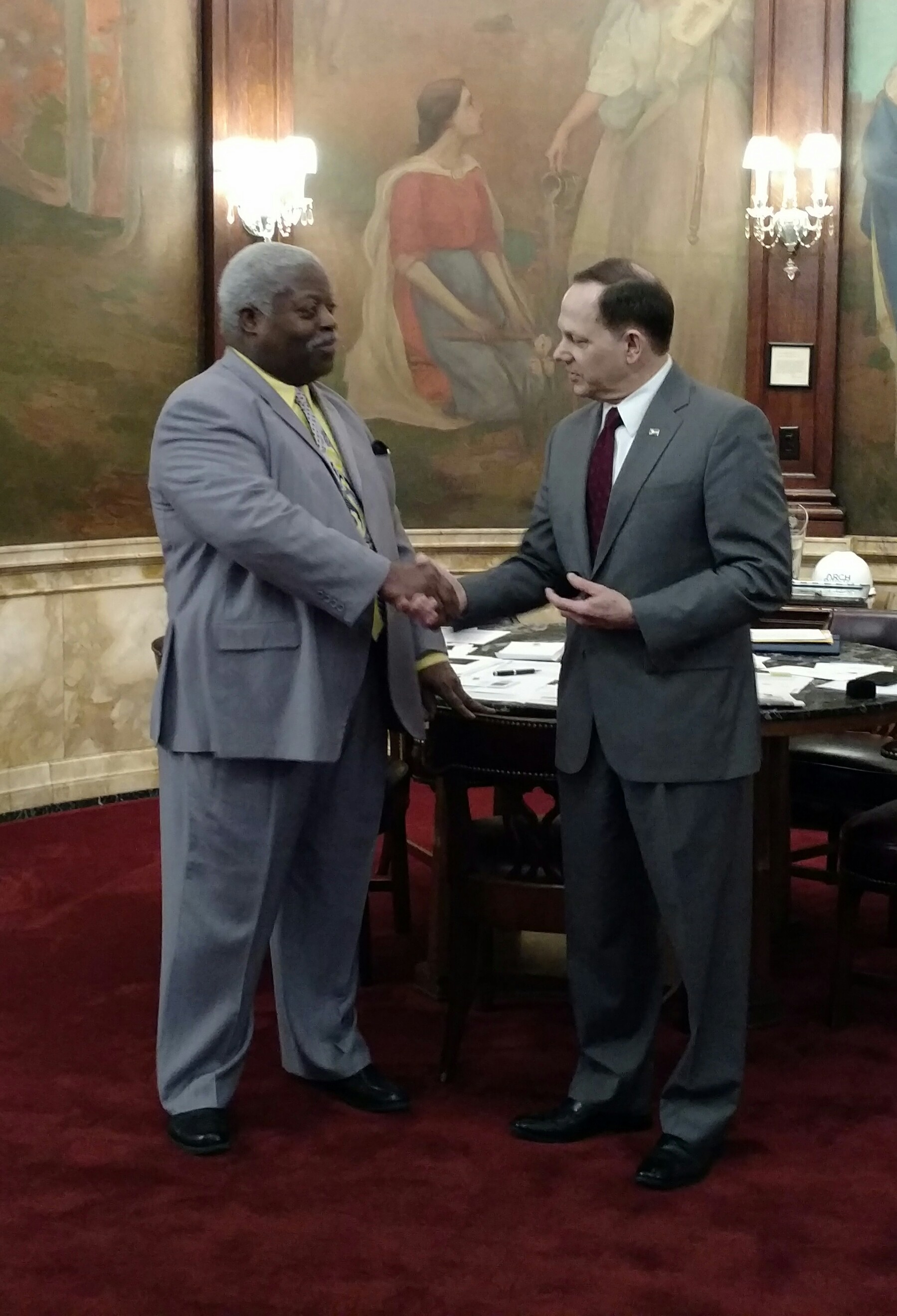 Mayor Francis Slay congratulates Robert Cotton on his 40 years of service with the City.