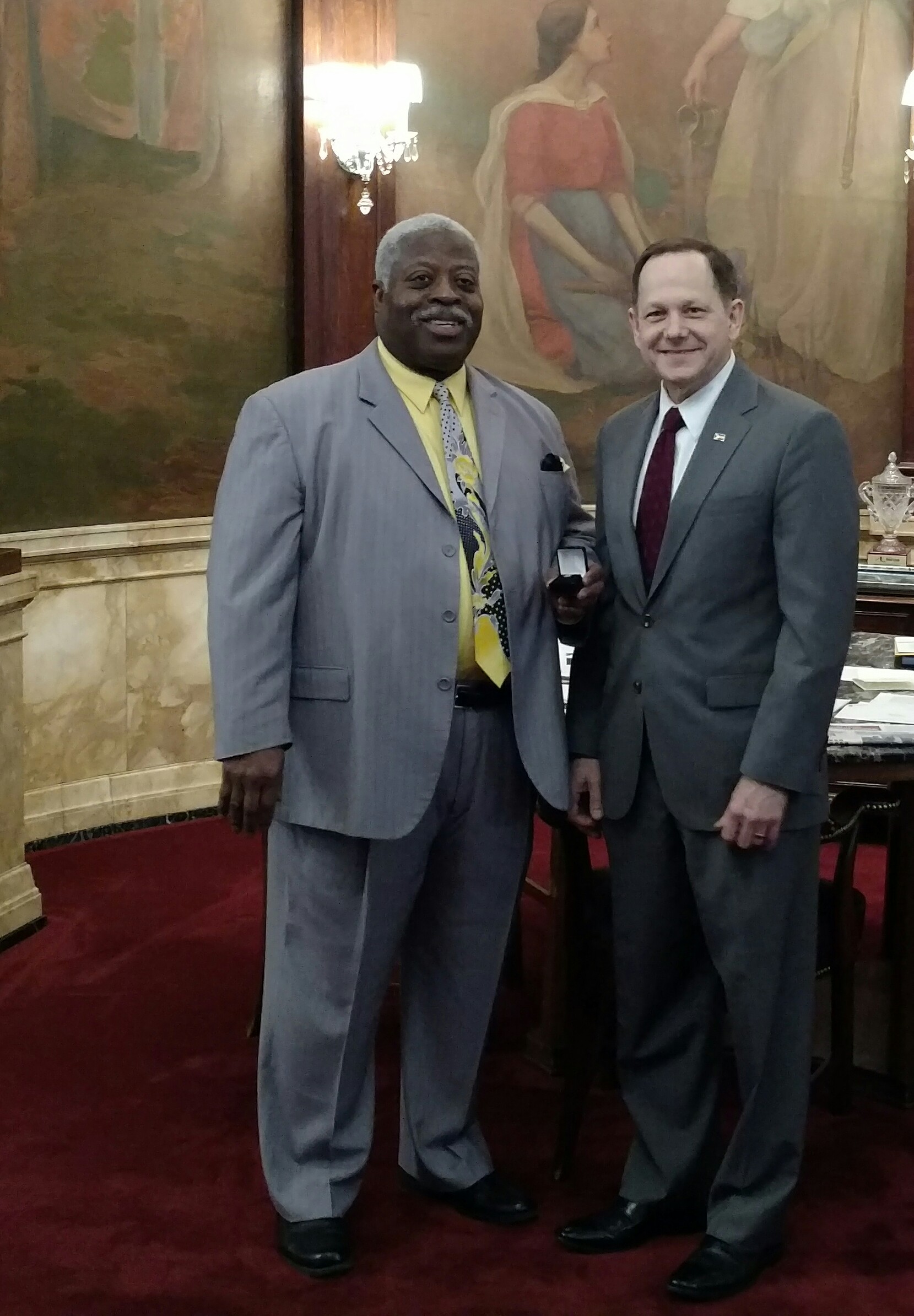 Robert Cotton receives his 40-year service pin from Mayor Francis Slay