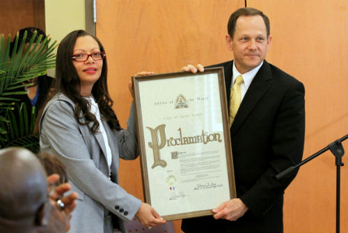 April Ford Griffin receives the Fair Housing Month proclamation from Mayor Francis G. Slay.