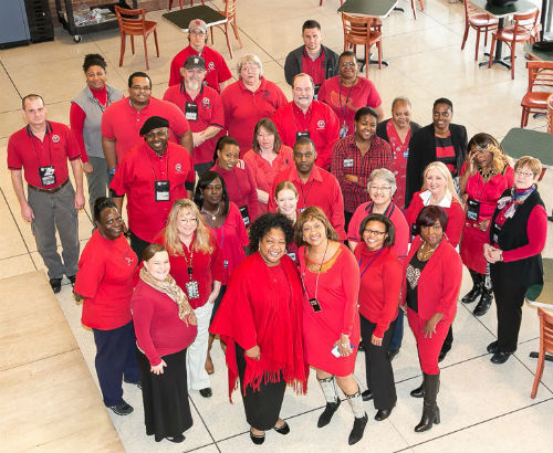 Group photo of Health Dept. staff sporting red in support of National Wear Red Day