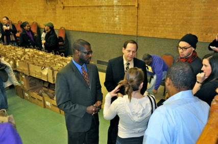 Alderman Jeffrey Boyd, Mayor Francis G. Slay and Patrick Brown meet with volunteers for CFL bulb distribution on Jan. 17, 2011.