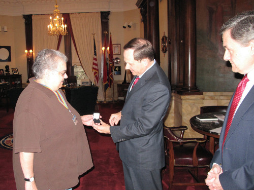 Carol Sears receives her 40 year service pin from Mayor Francis G. Slay as Assessor Ed Bushmeyer looks on 041511 