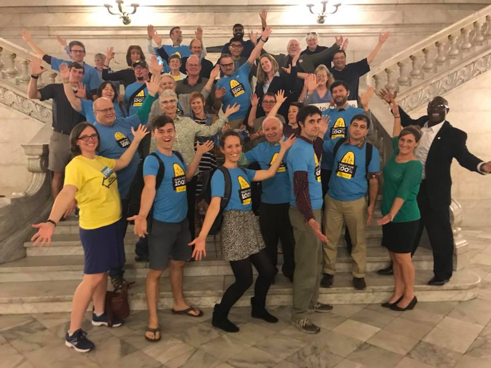 Clean Energy Team posing on the City Hall Rotunda steps