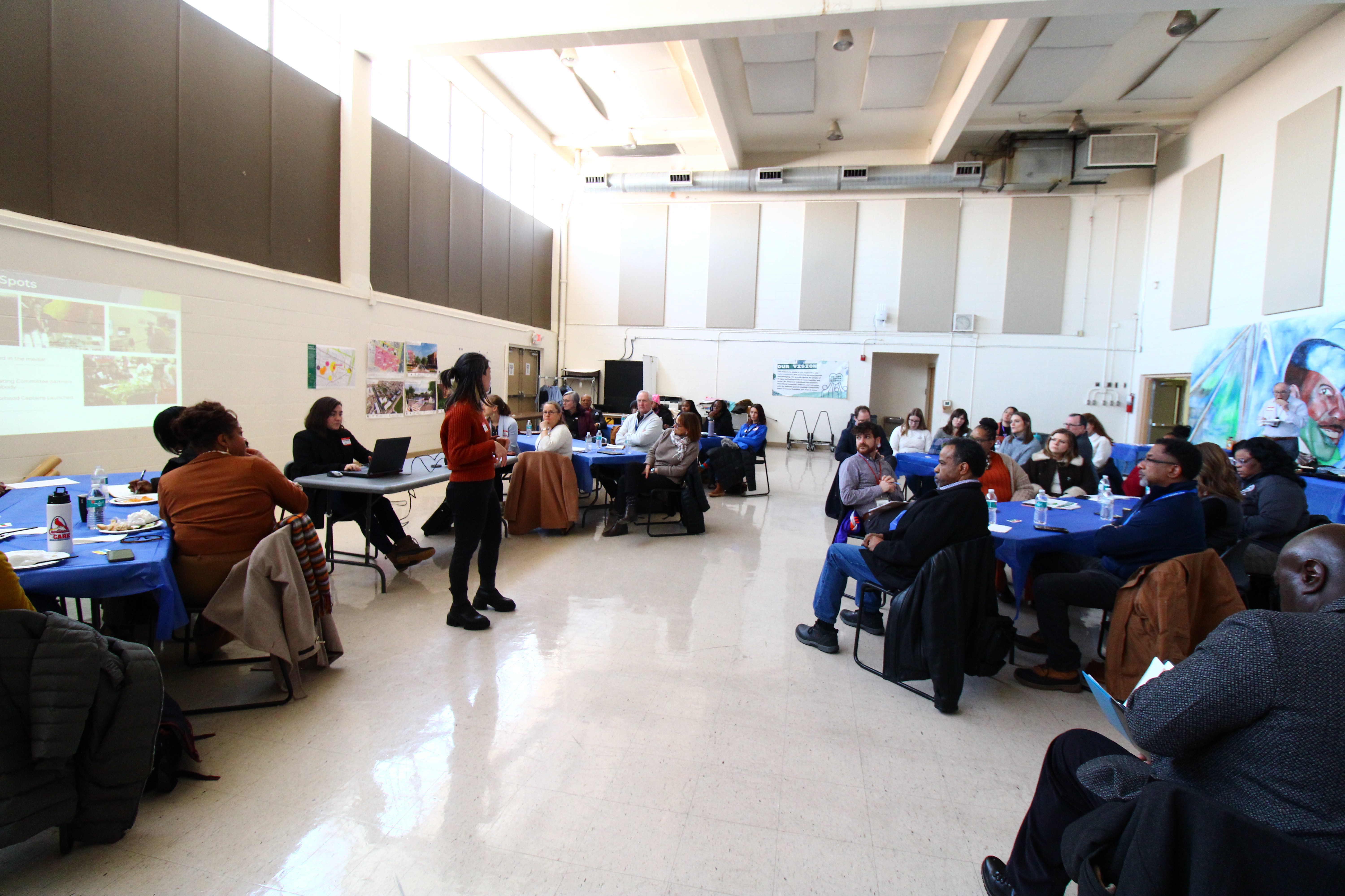 Stephanie Co, Senior Project Manager for Preservation of Affordable Housing, Inc., speaks at the Clinton Peabody residents council on February 202, 2025.