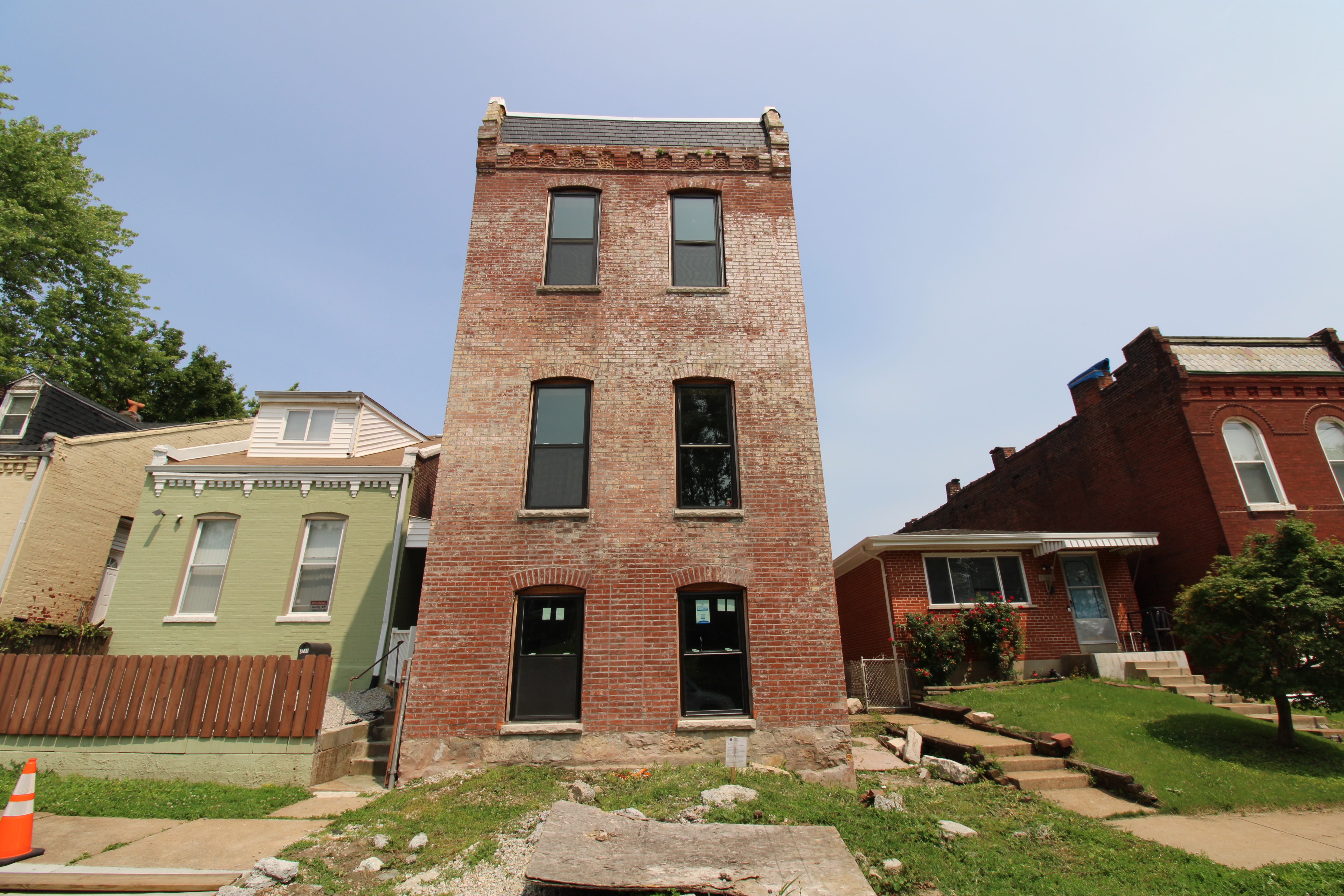 Three story brick house under renovation exterior