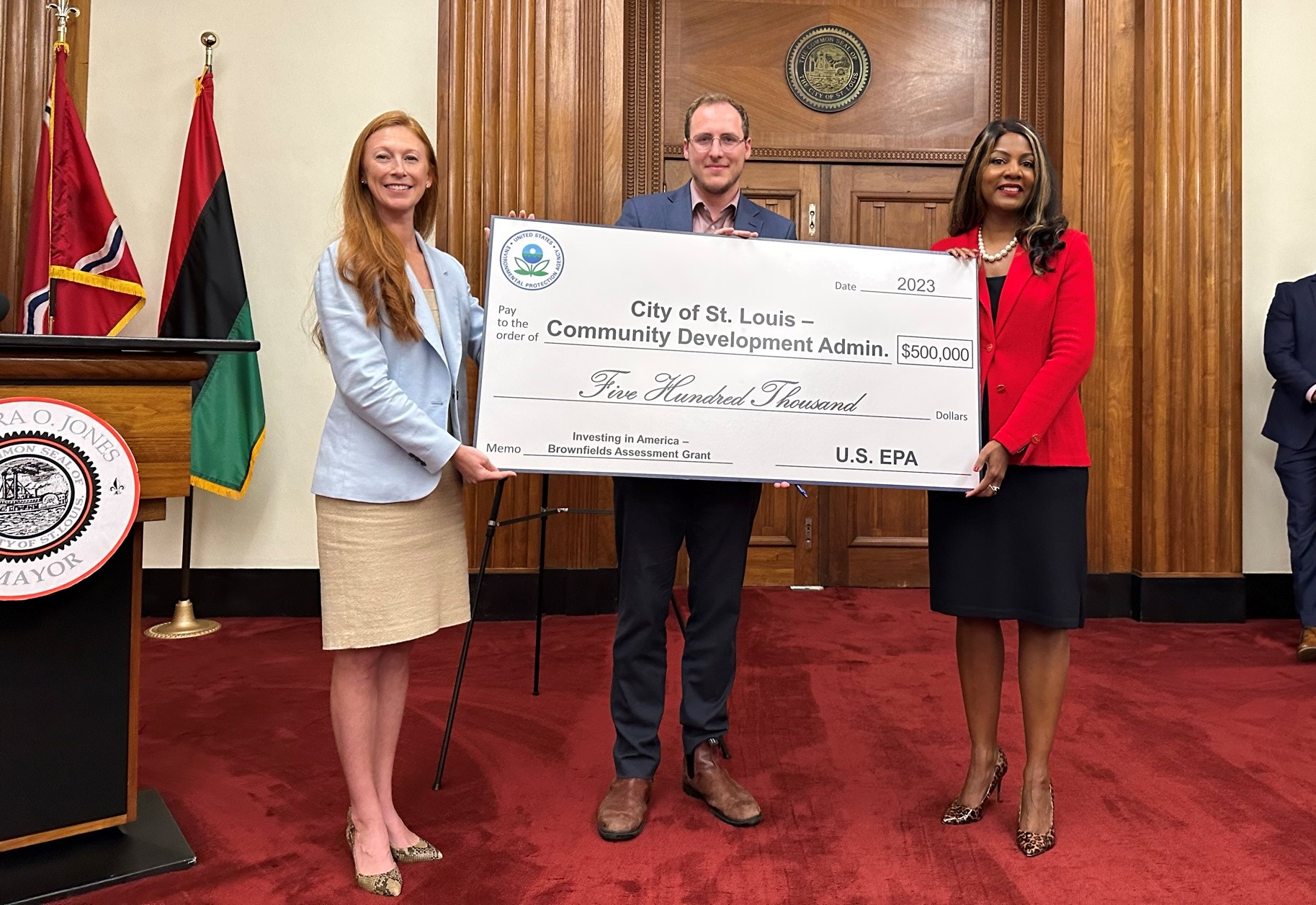 EPA Meg McCollister joined by St. Louis Mayor Tishaura O. Jones and CDA Executive Director Nahuel Fefer CDA St. Louis Mayor Jones Nahuel Fefer holding big check for $500K grant