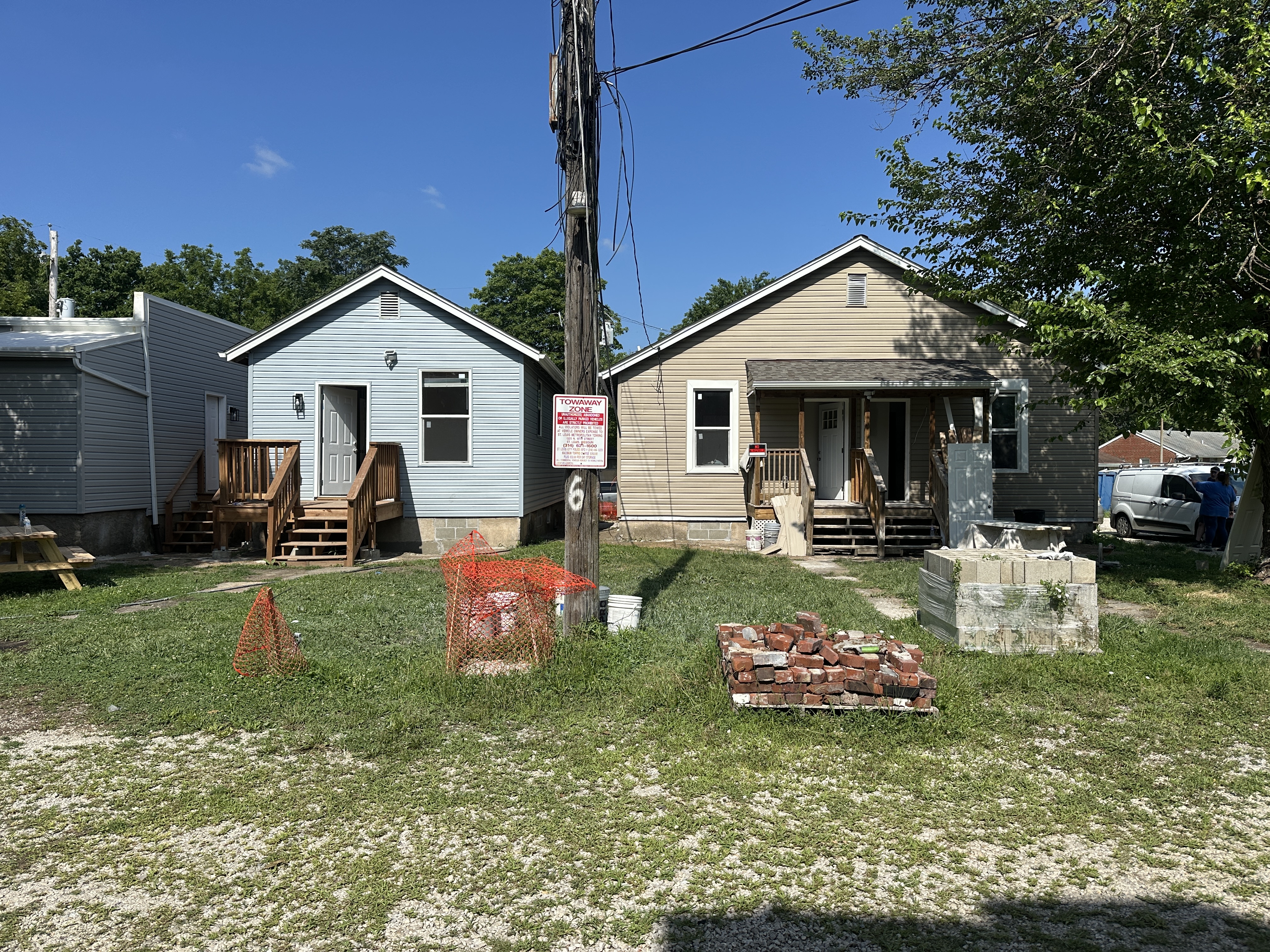 Back of the three single family homes connected to a community courtyard.