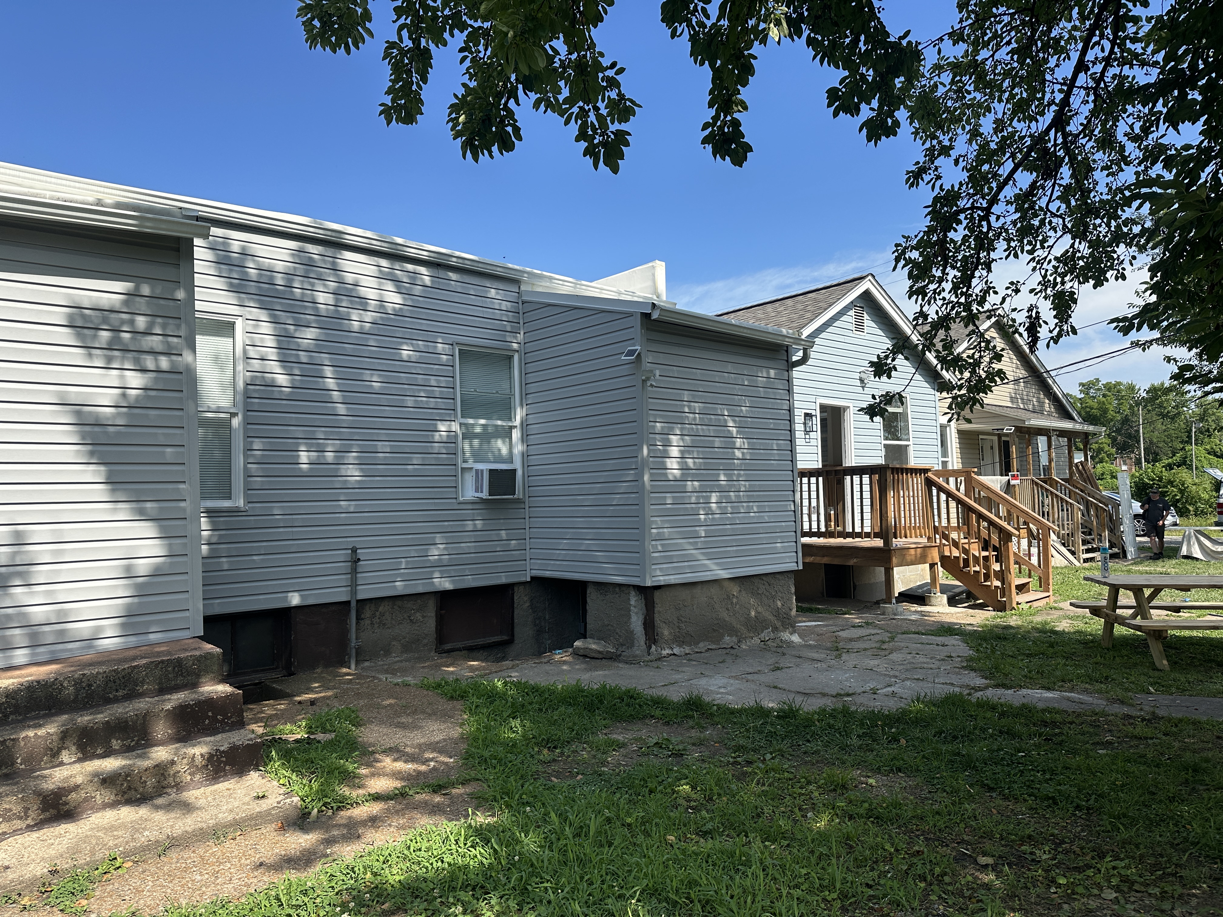 Back of the three single family homes connected to a community courtyard.