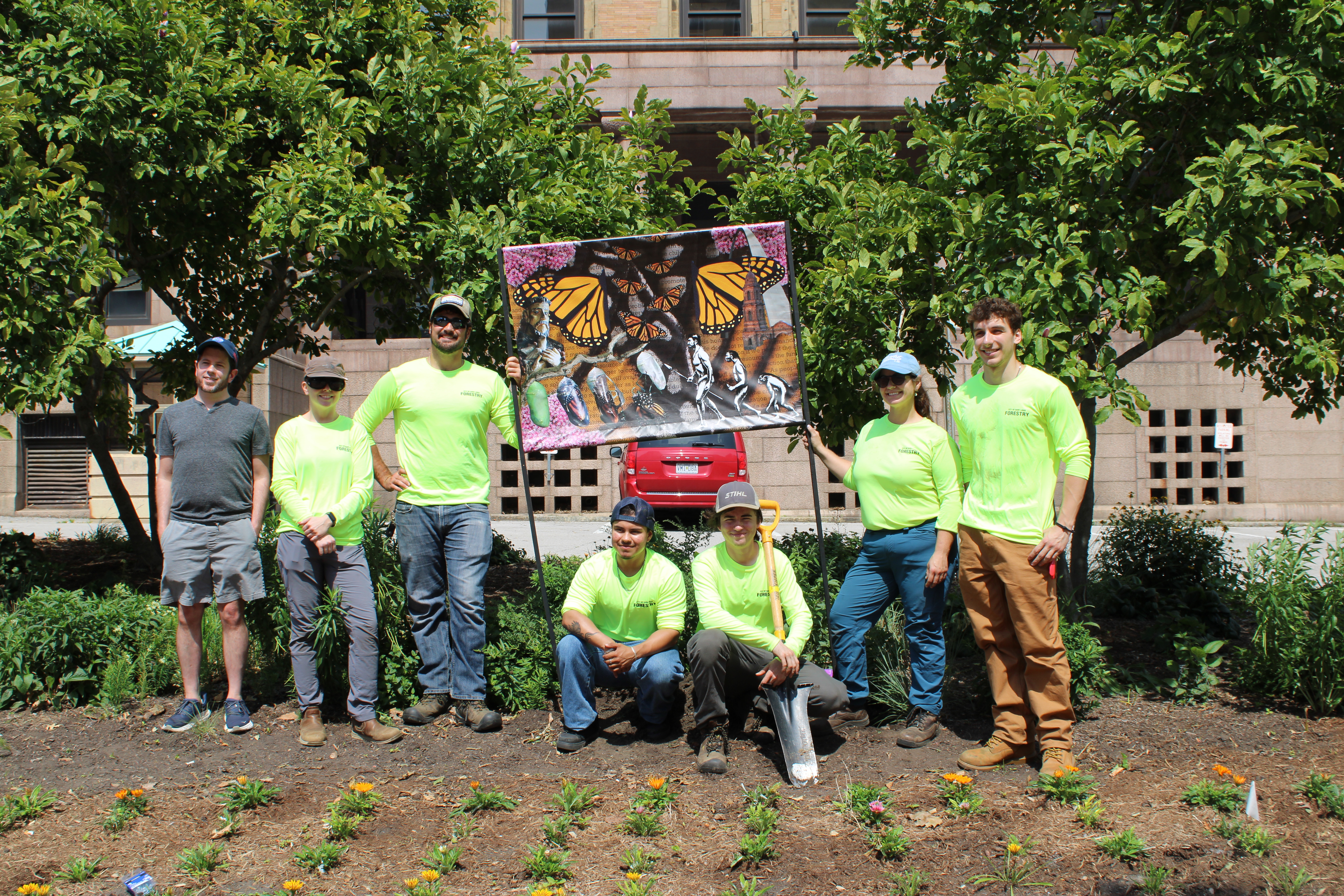 From left: Vaughn Anderson, Associate Professor, Maryville University, Elizabeth Dasenbrock, Project Coordinator/Nature Steward, and other City of St. Louis Department of Forestry staff members pose with the newly introduced murals.