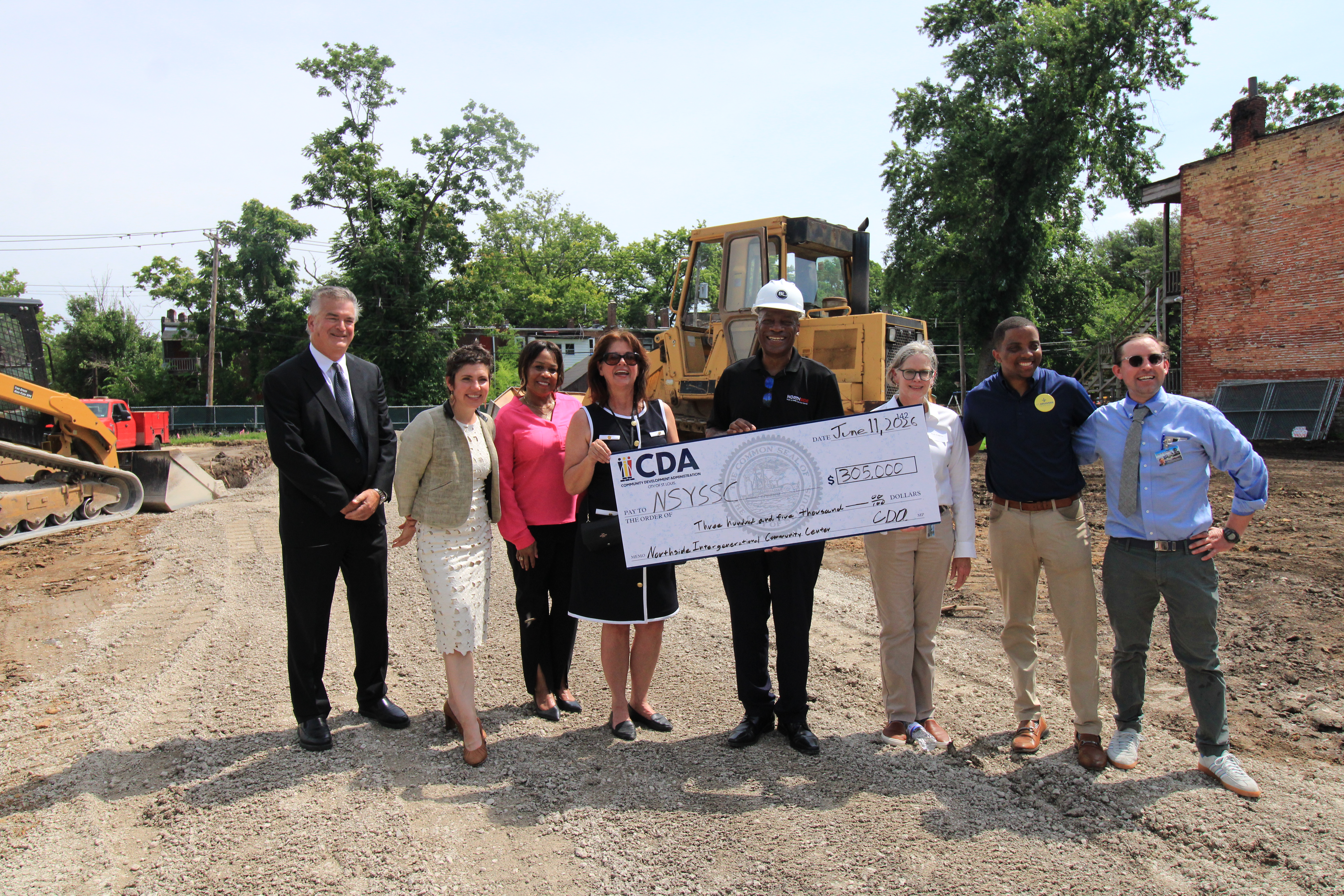 CDA staff and Mayor Cara Spencer and CDA staff present NSYSSC Executive Director Leon Threat (middle with hard hat). Left to right are CDA Executive Director Matt Moak, Mayor Cara Spencer, Marnita Spight (CDA), Anita Poole (CDA), Leon Threat, Ruth Keenoy 