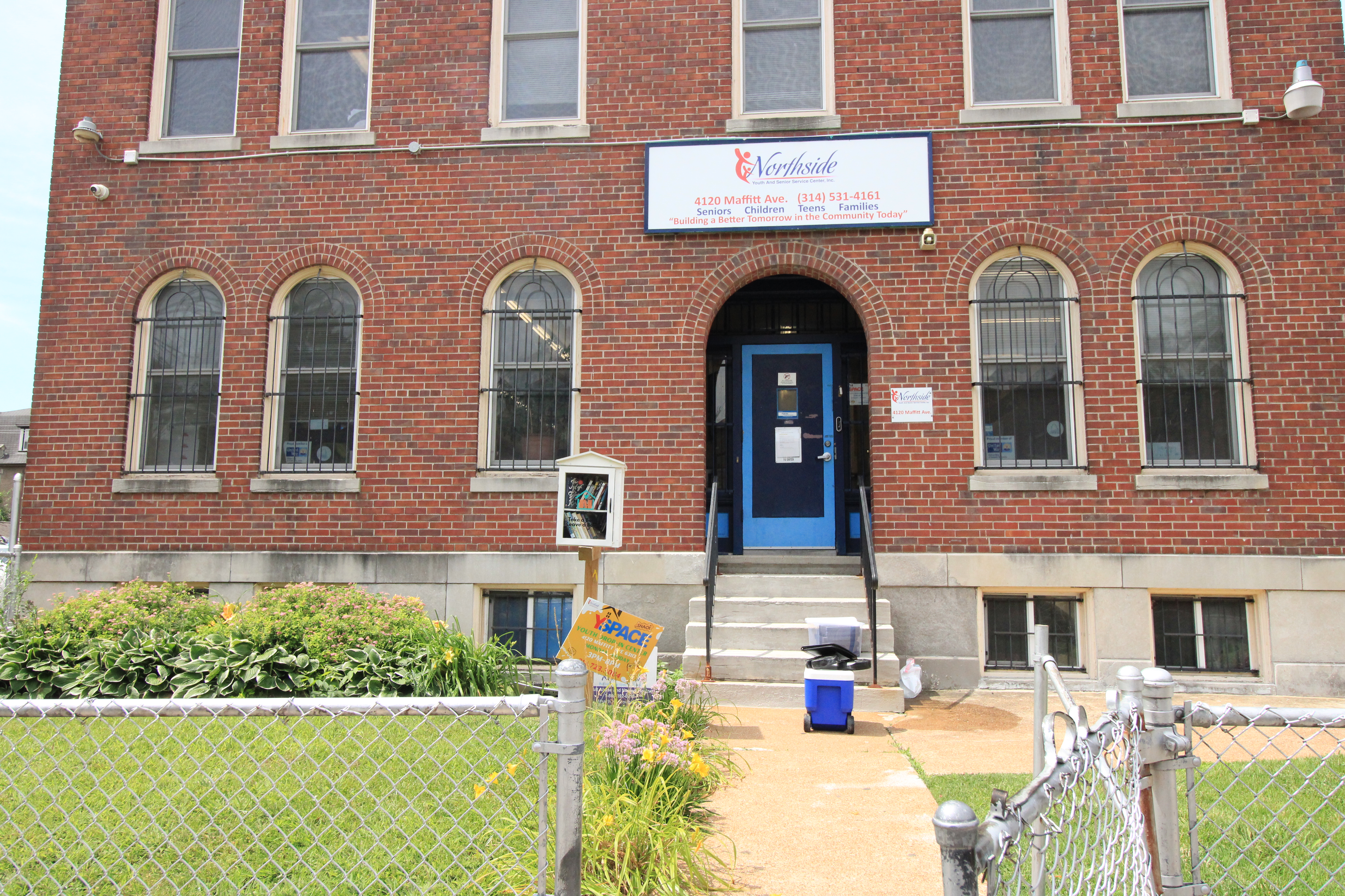 Northside Youth and Senior Services Current Building and Front Yard
