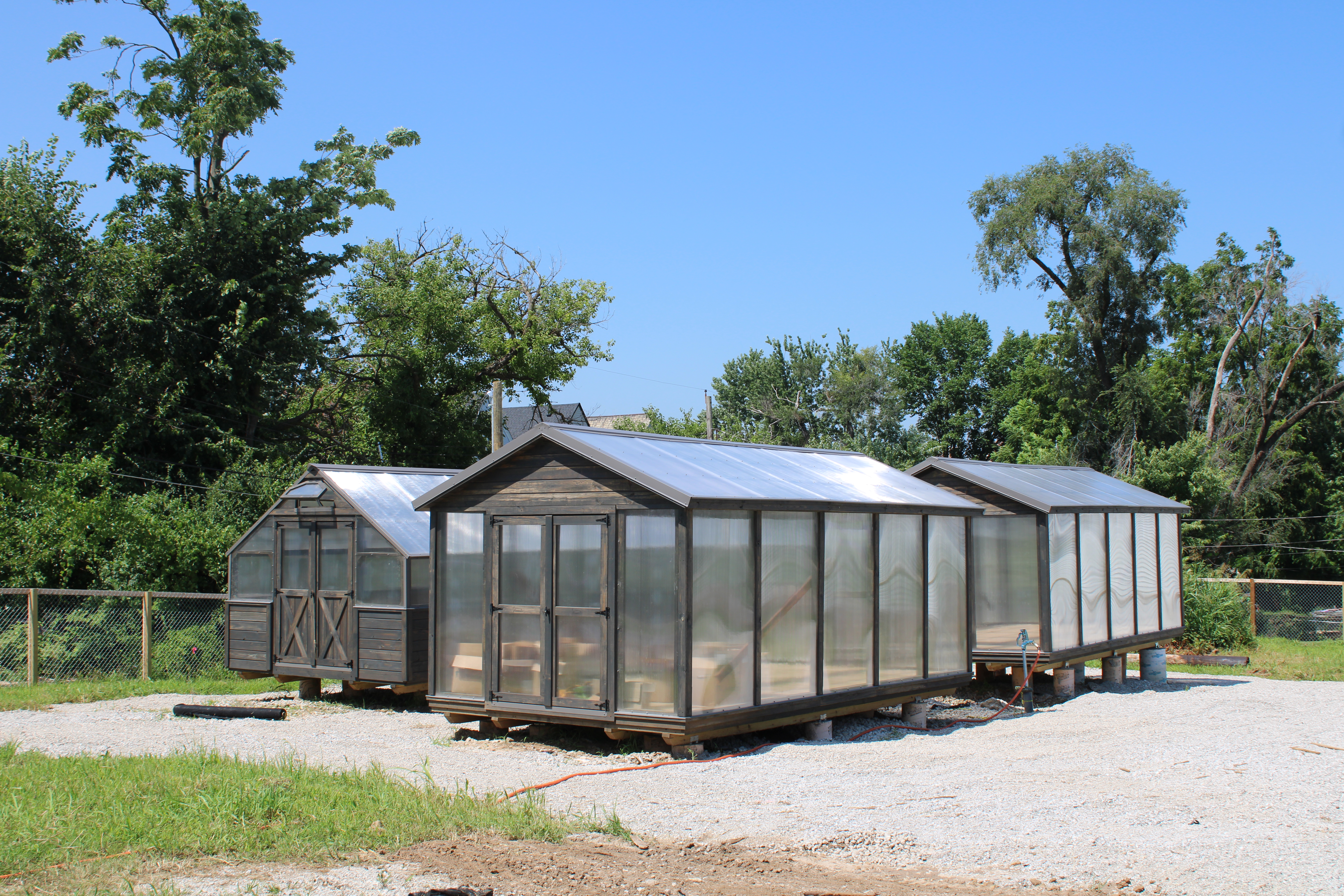 Three greenhouses within the garden.