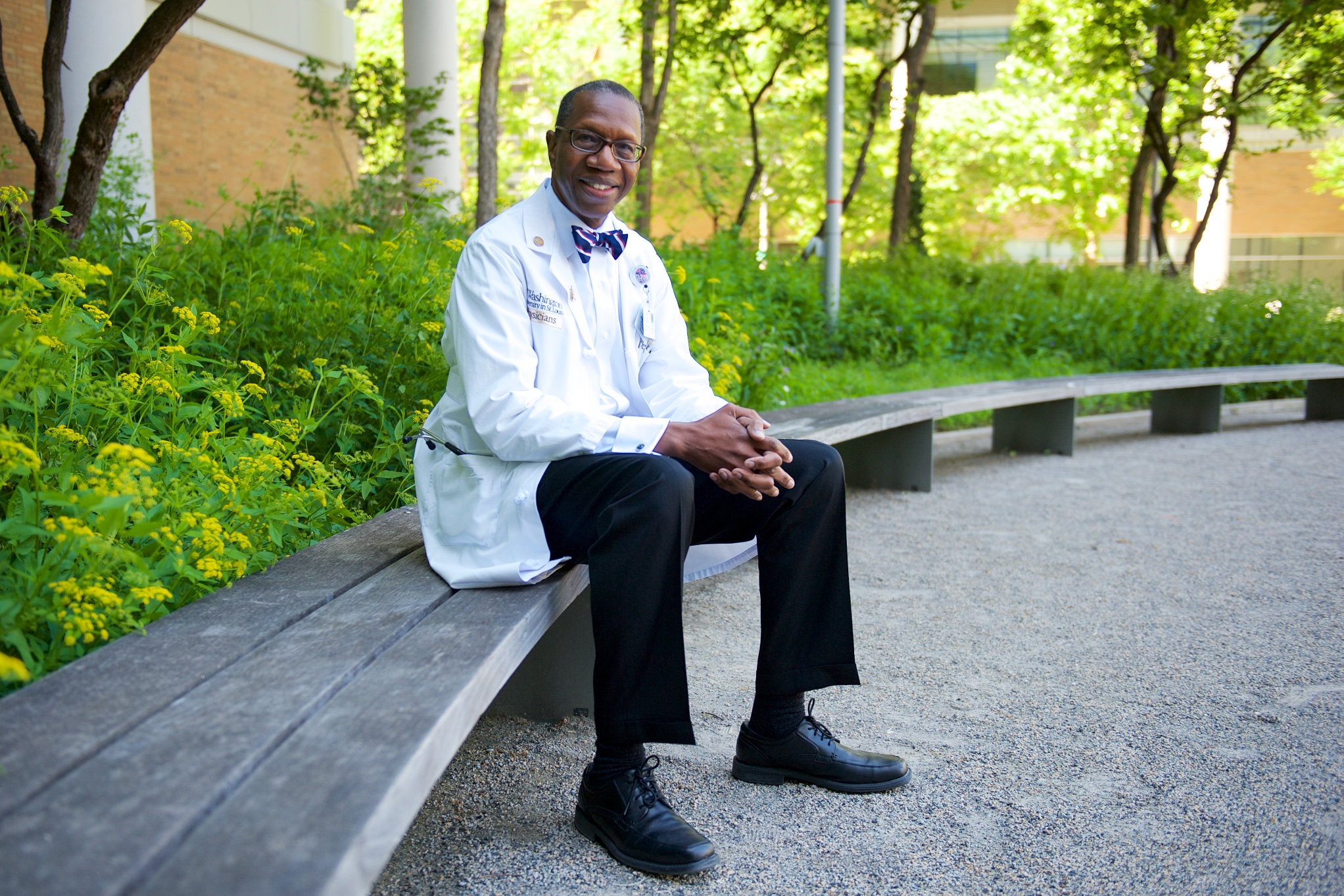 Will Ross seated on campus