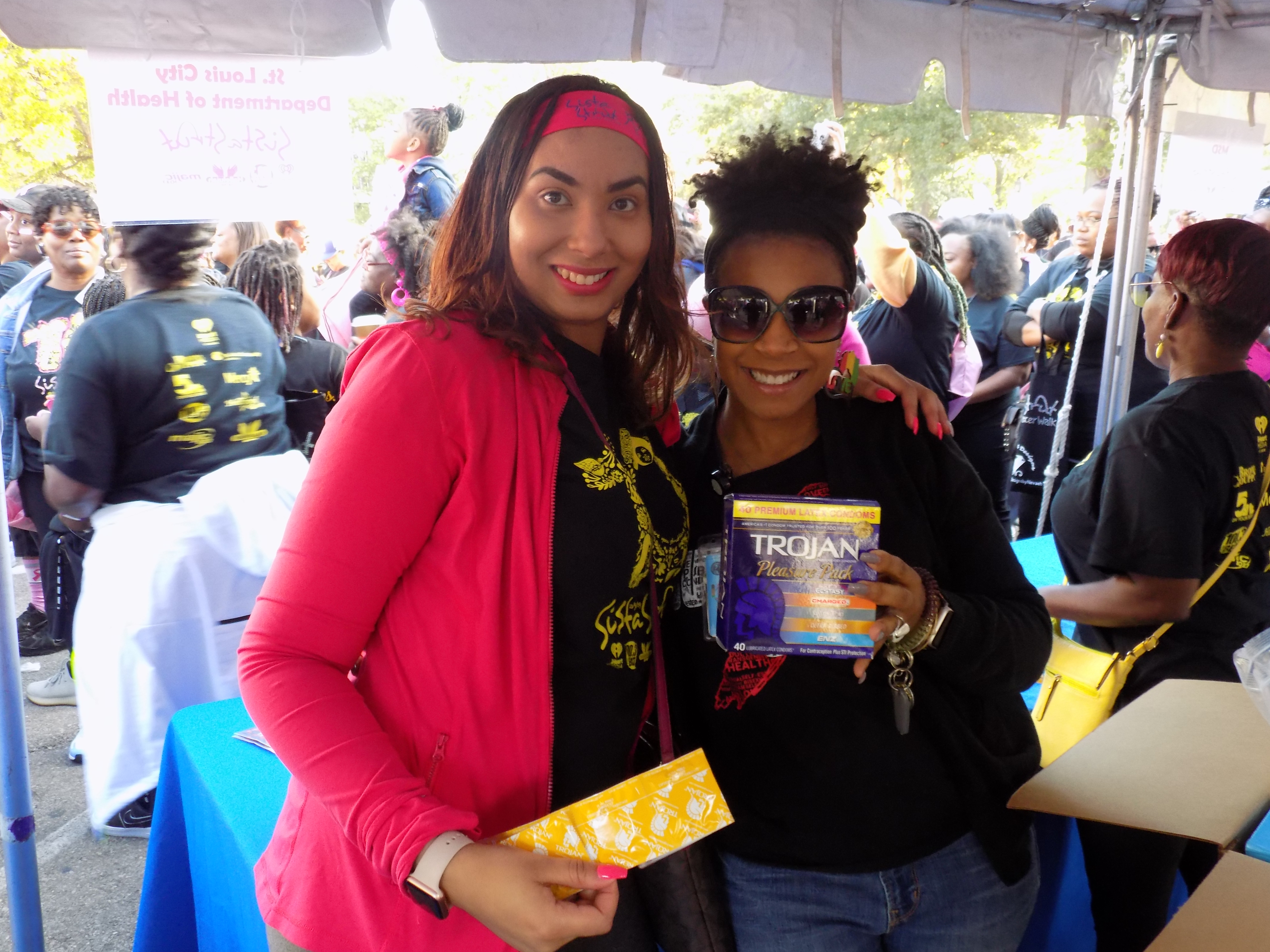 DOH staff promote sexual health by distributing safe sex supplies to attendees