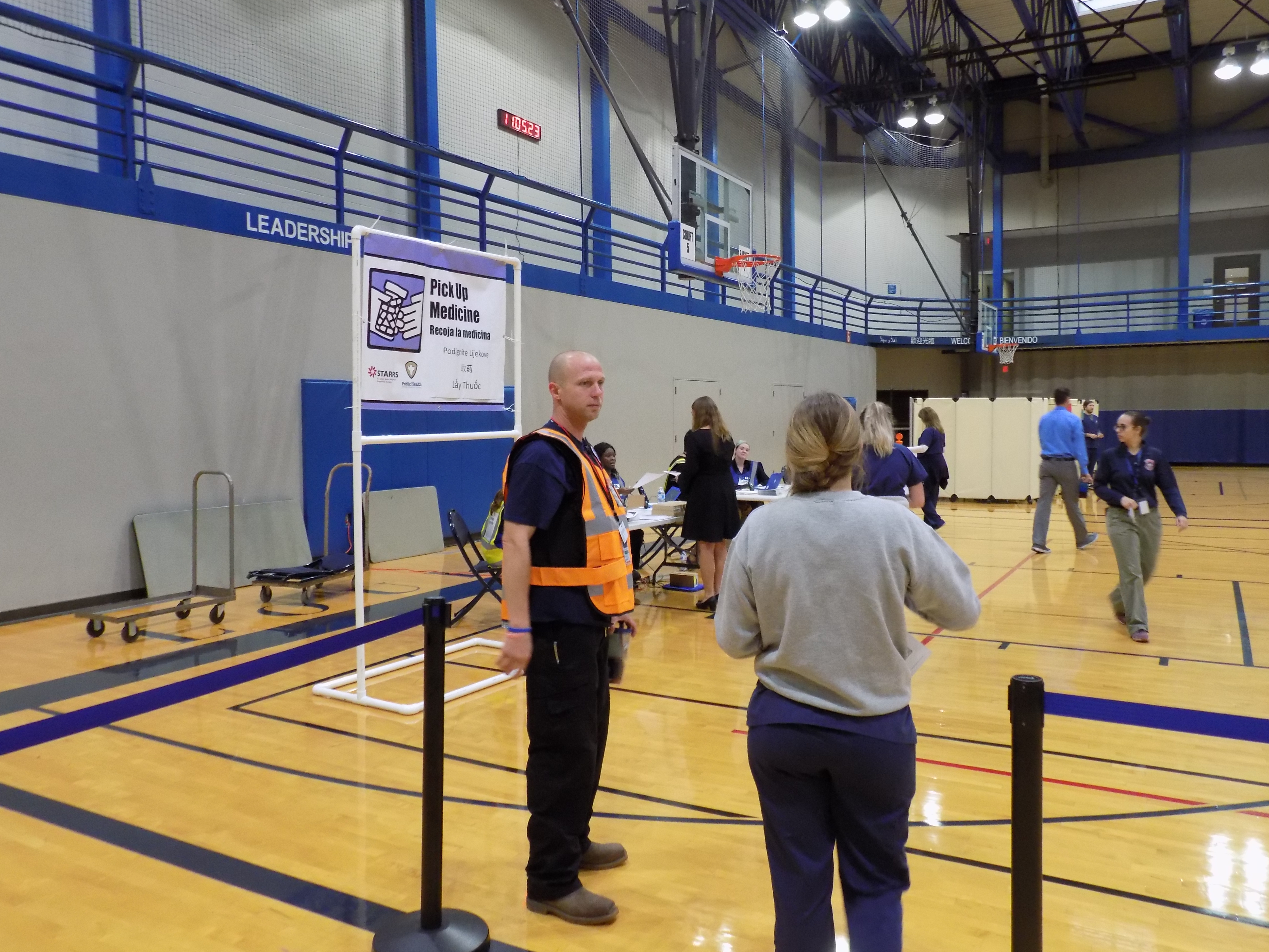 A volunteer waits to receive medications as part of the exercise.