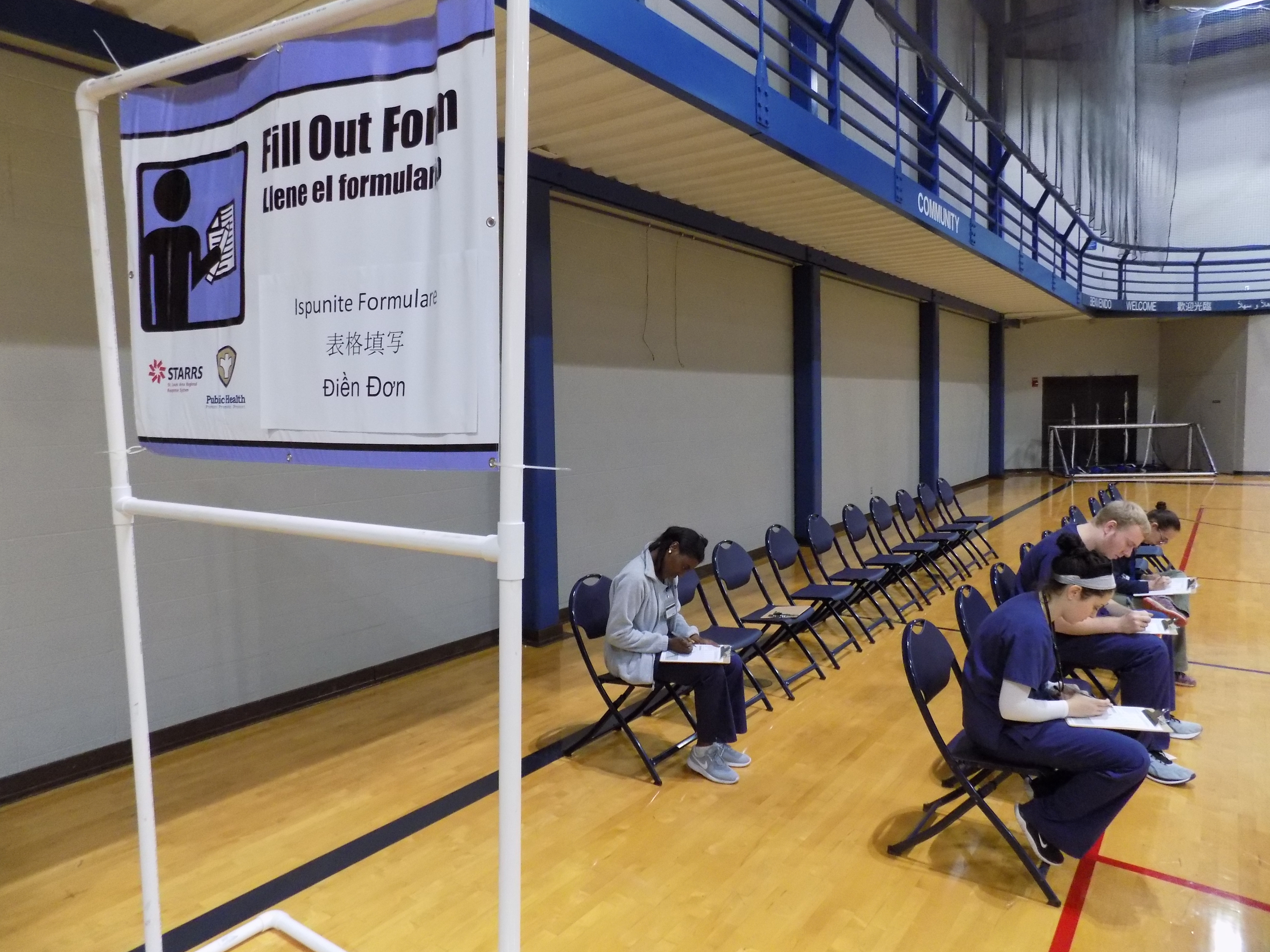 Volunteers begin the process by filling out forms.