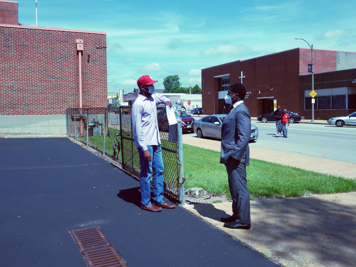 City Director of Health Dr. Fredrick Echols speaks with Rev. Anthony Riley, Senior Pastor of Central Baptist Church during the July 2 testing event.