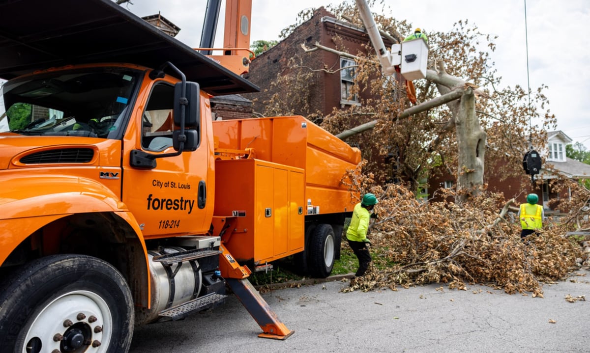 City employees work to clear debris