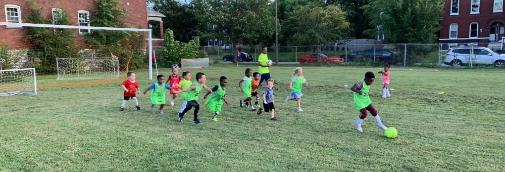 Girls and boys playing soccer