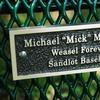 Weasel baseball plaque on bench