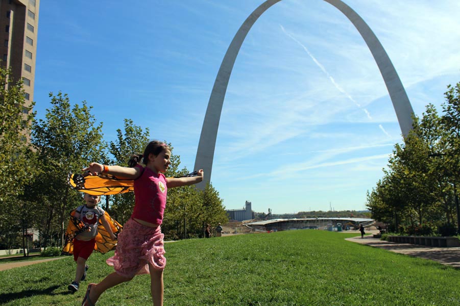 CHildren Running with Monarch Butterfly wings by St. Louis Arch