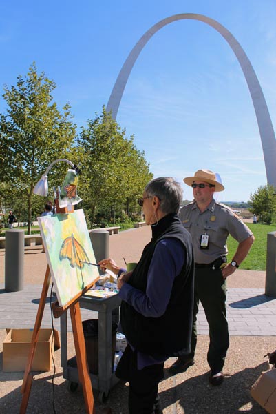 Artist painting Monarch Butterfly at St. Louis Arch