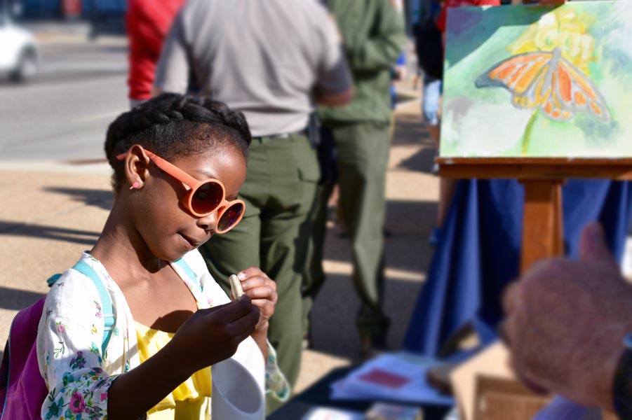 Girl with glasses attending Great Monarch Migration Event