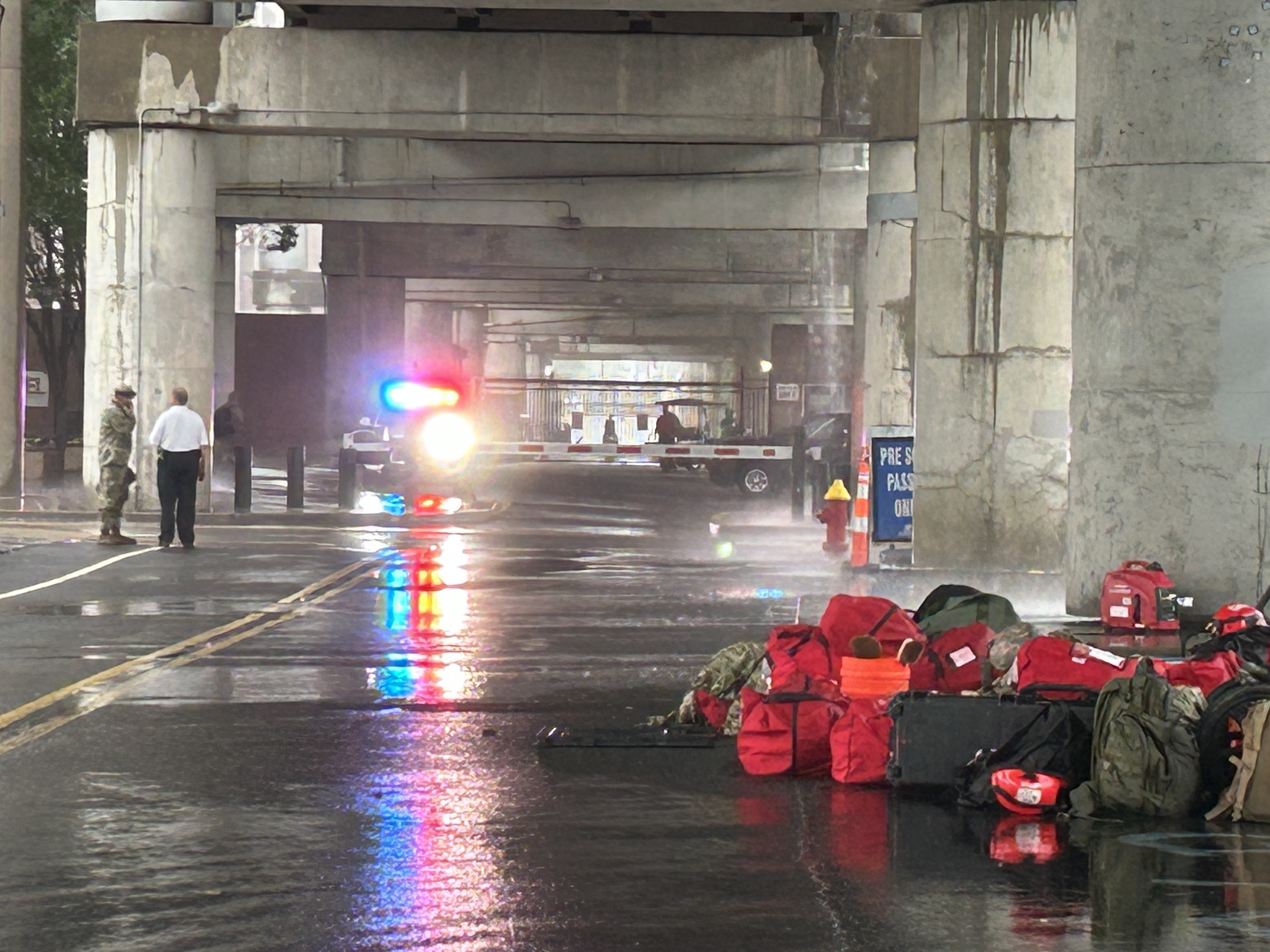Exercise participants use Interstate 64/40 bridge spans to avoid heavy rains over St. Louis