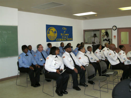 The graduates and those being promoted wait for the start of the ceremony.