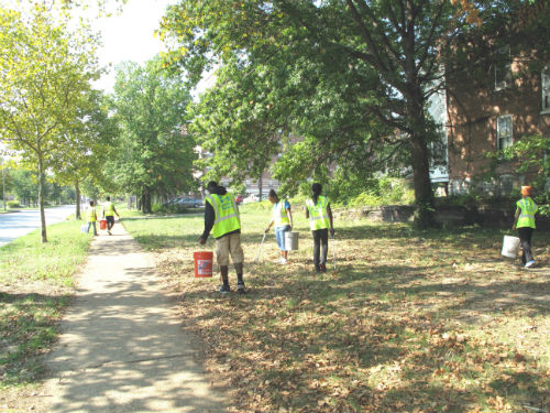 Garden rangers at work on lot at Kingshighway and Northland