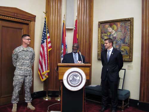 Michael K. Holmes, Executive Director of the St. Louis Agency of Training and Employment, speaks at the Show-Me Heroes Flag of Freedom award ceremony on July 23, 2013, in City Hall. Also pictured: (L) Lt. Jon Berry, Director of Show-Me Heroes and Dr. Tommy Sowers, VA Assistant Secretary.