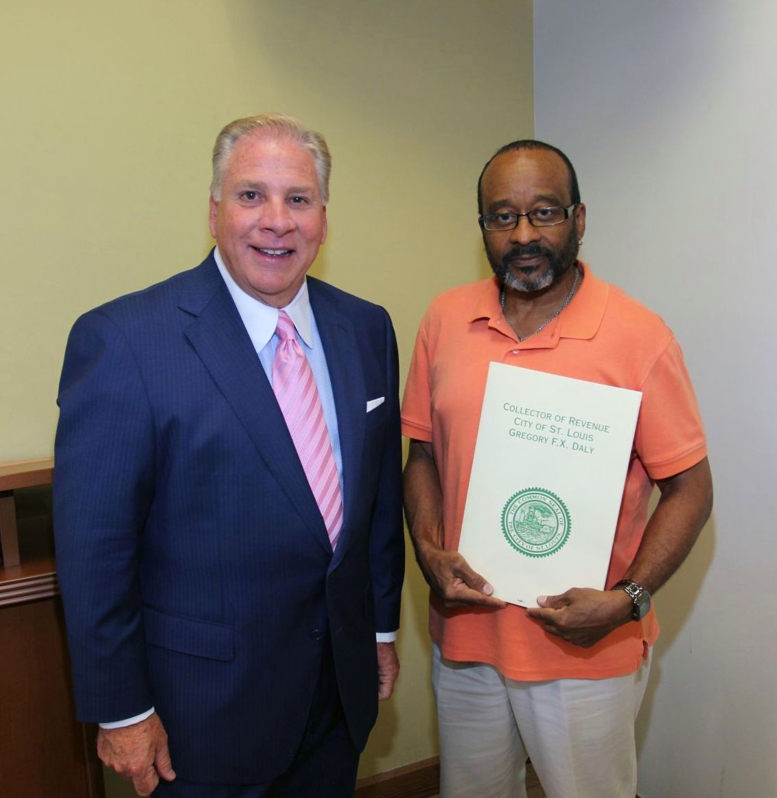 Collector of Revenue Gregory F.X. Daly congratulates David Dickerson on 10 years of service with the Collector's office.