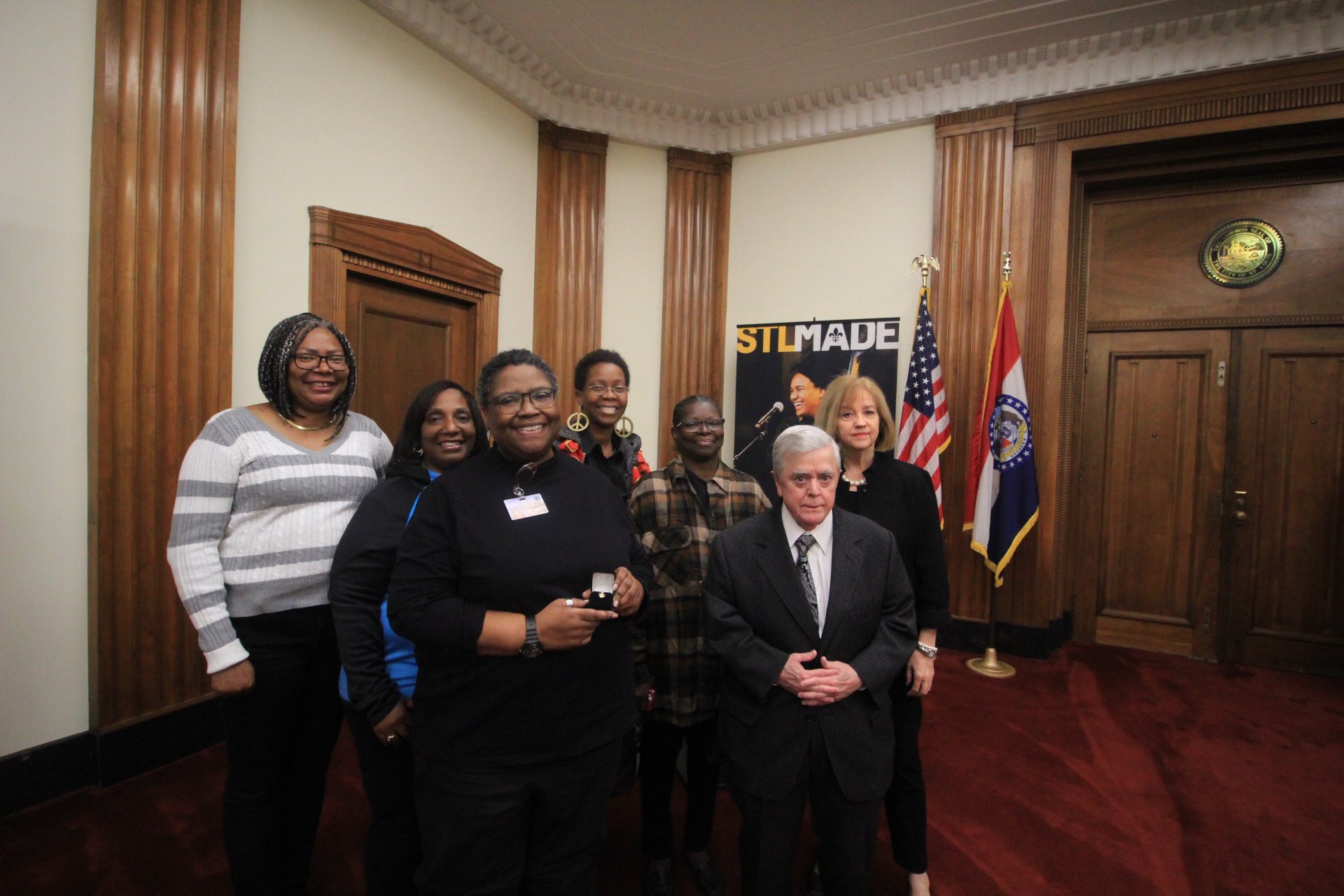 Group photo of Warren with fellow City employees during the ceremony