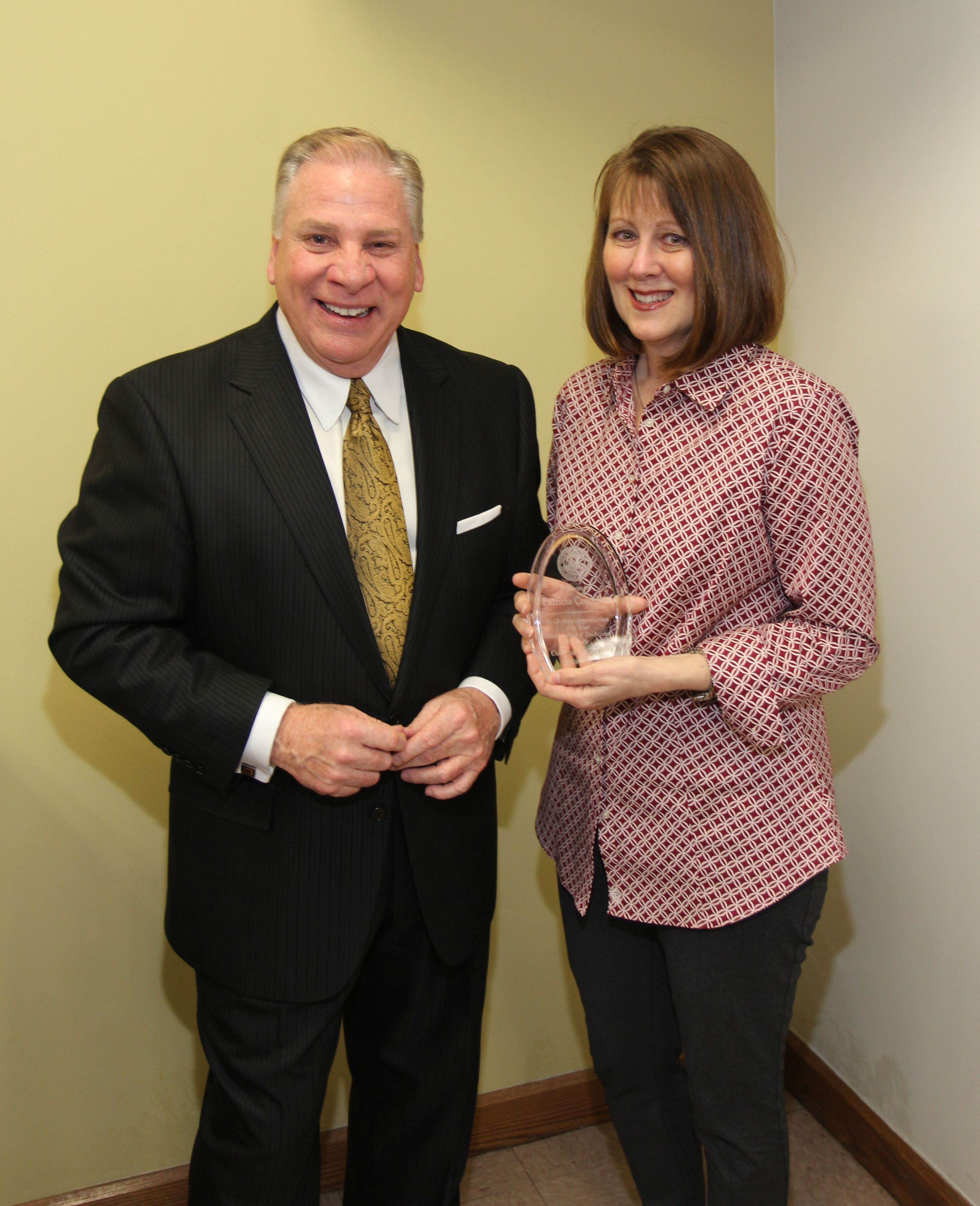 Collector of Revenue Gregory F.X. Daly congratulates Patty Crecelius on her retirement on March 29, 2018.