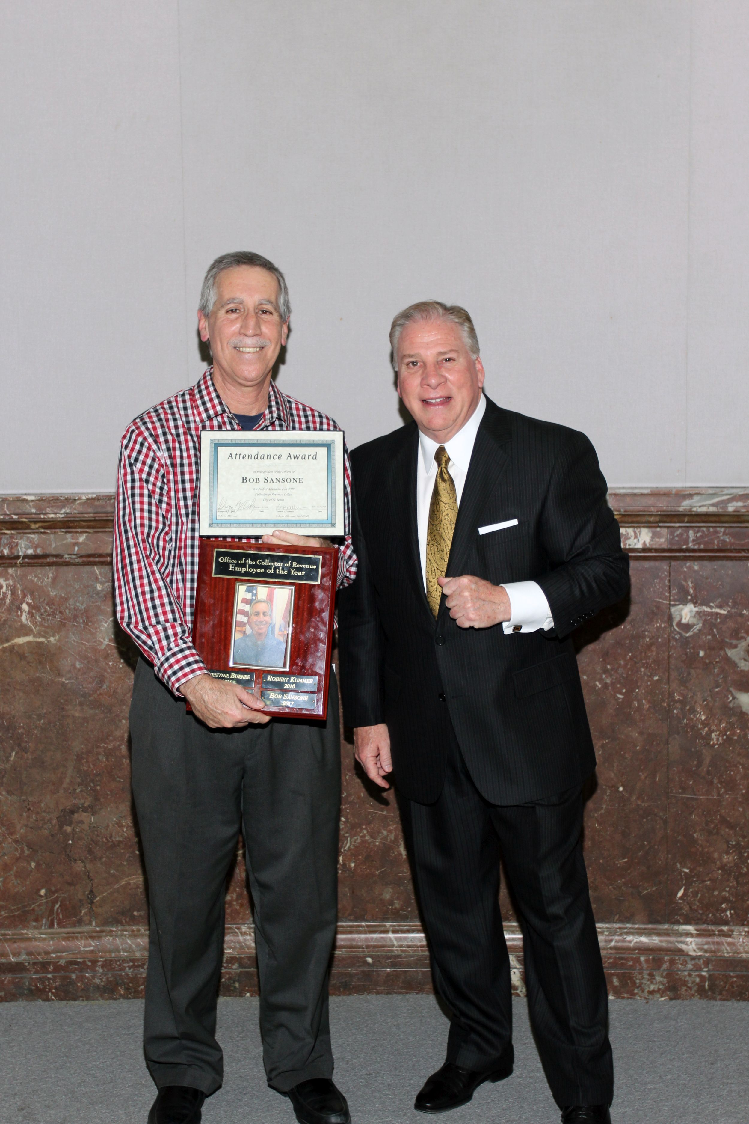 Bob Sansone receives the 2017 Employee of the Year Award from Collector of Revenue Gregory F.X. Daly on Feb. 16, 2018.