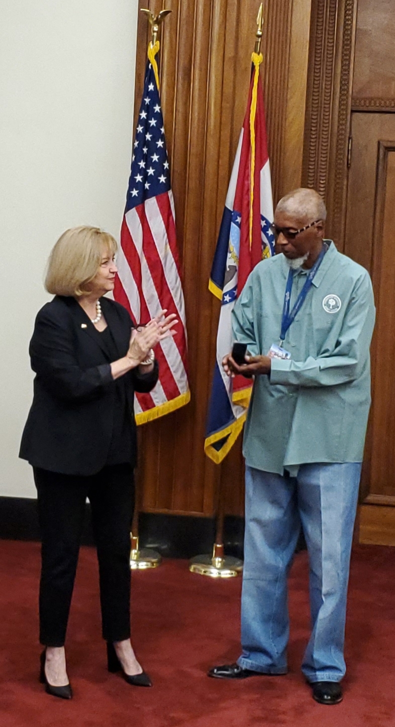 Pictured from left:  Mayor Lyda Krewson, Mario Williams from the Forestry Division