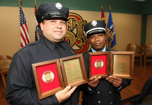 Matt Kotraba (l) and Galen Taylor received Liberty Mutual Firemark Awards for saving a baby.
