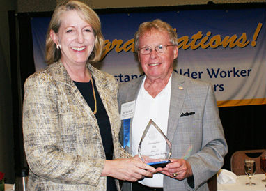 Bill Siedhoff receives award from Gail Vasterling