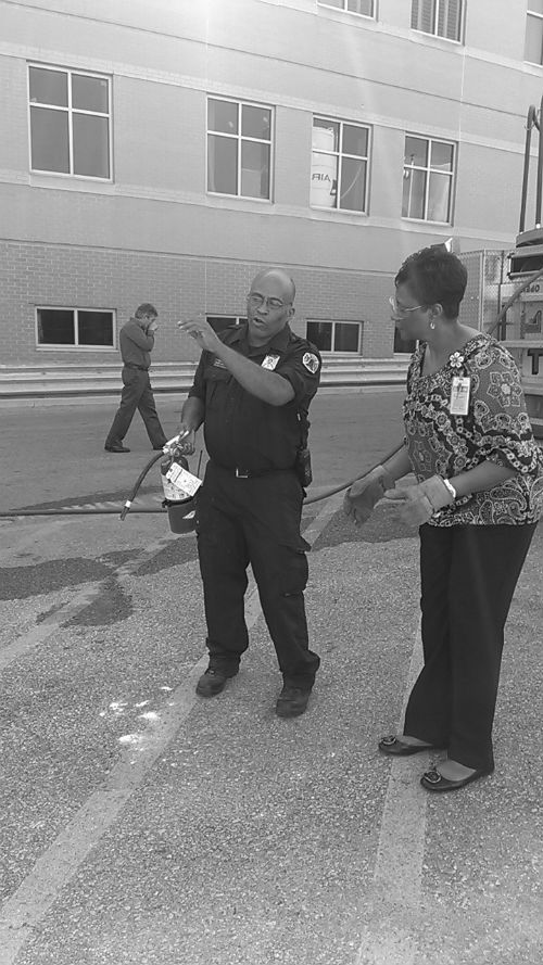 Firefighter Randy Barnes gives a fire demo at the Cardinal Glennon Employee Disaster Fair on Aug. 30, 2012.