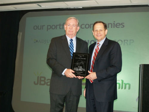 Hal Gentry of Capital Innovators accepts Spirit Award from Mayor Slay