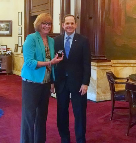 Charlene Deeken receives her 40-year pin from Mayor Francis G. Slay on February 19, 2016