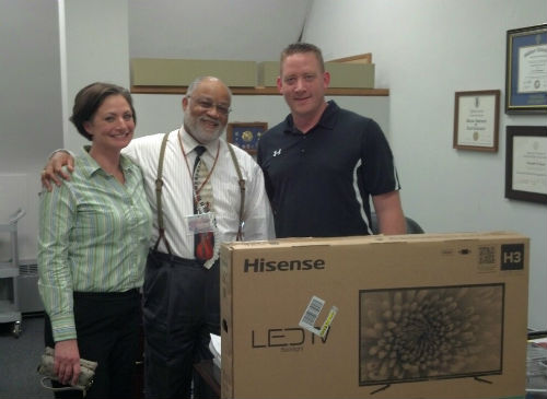 Dr. Ken Stone (center) with reps from Washington National Insurance Company on March 5, 2015.