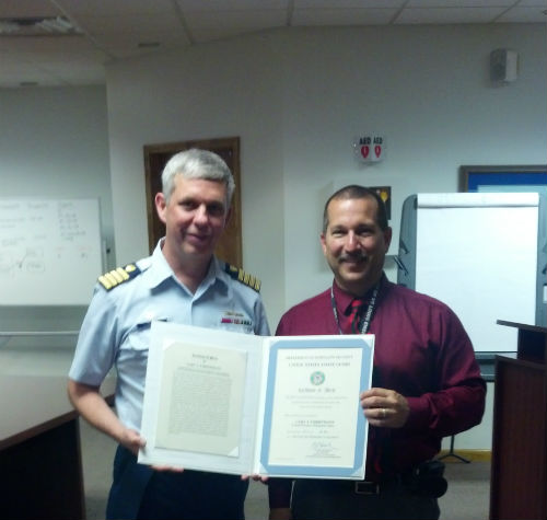 Gary Christmann receives U.S. Coast Guard Certificate of Merit in June 2014.