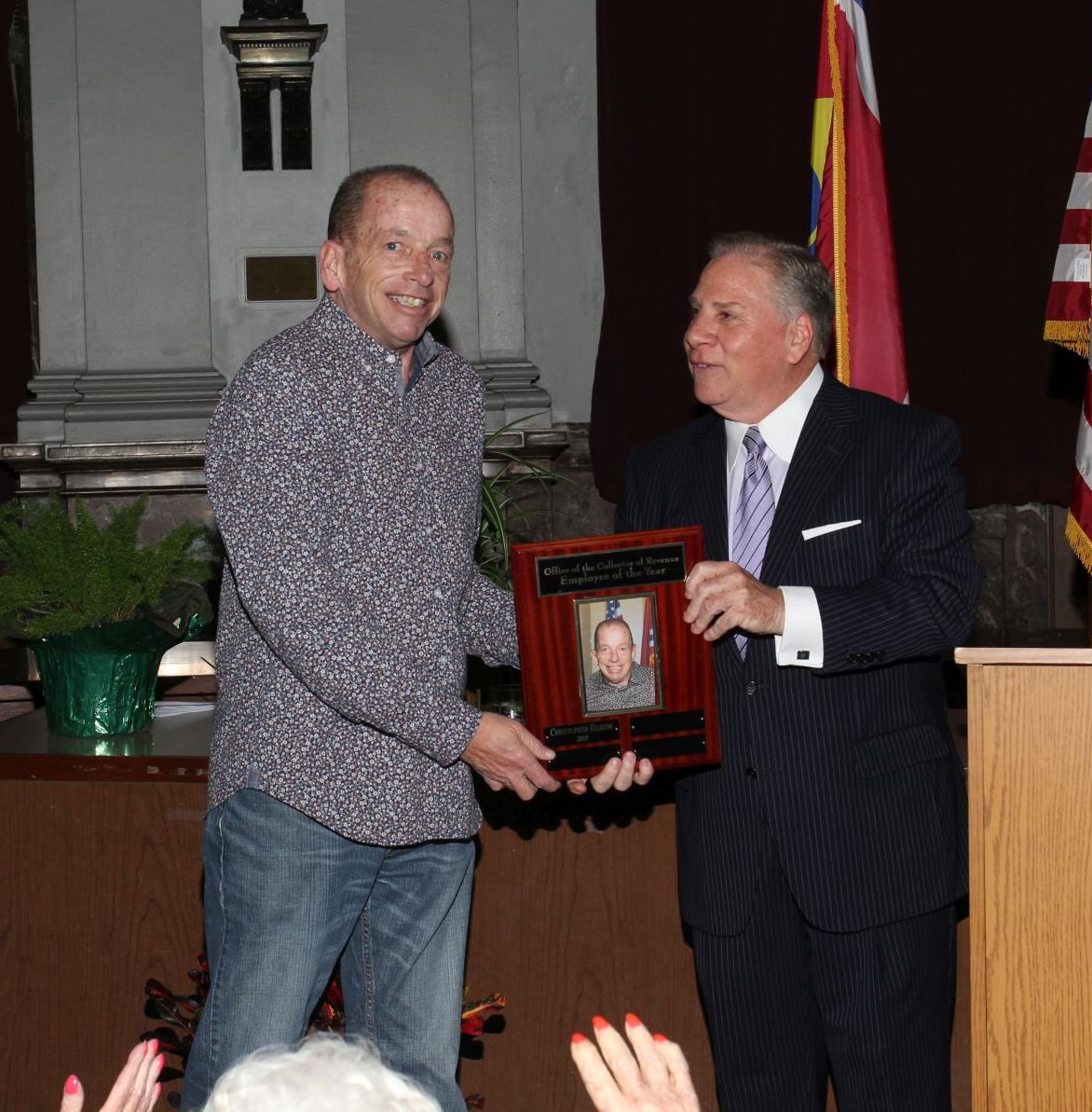 Christopher Ellison receives the 2018 COR Employee of the Year Award from Collector of Revenue Gregory F.X. Daly