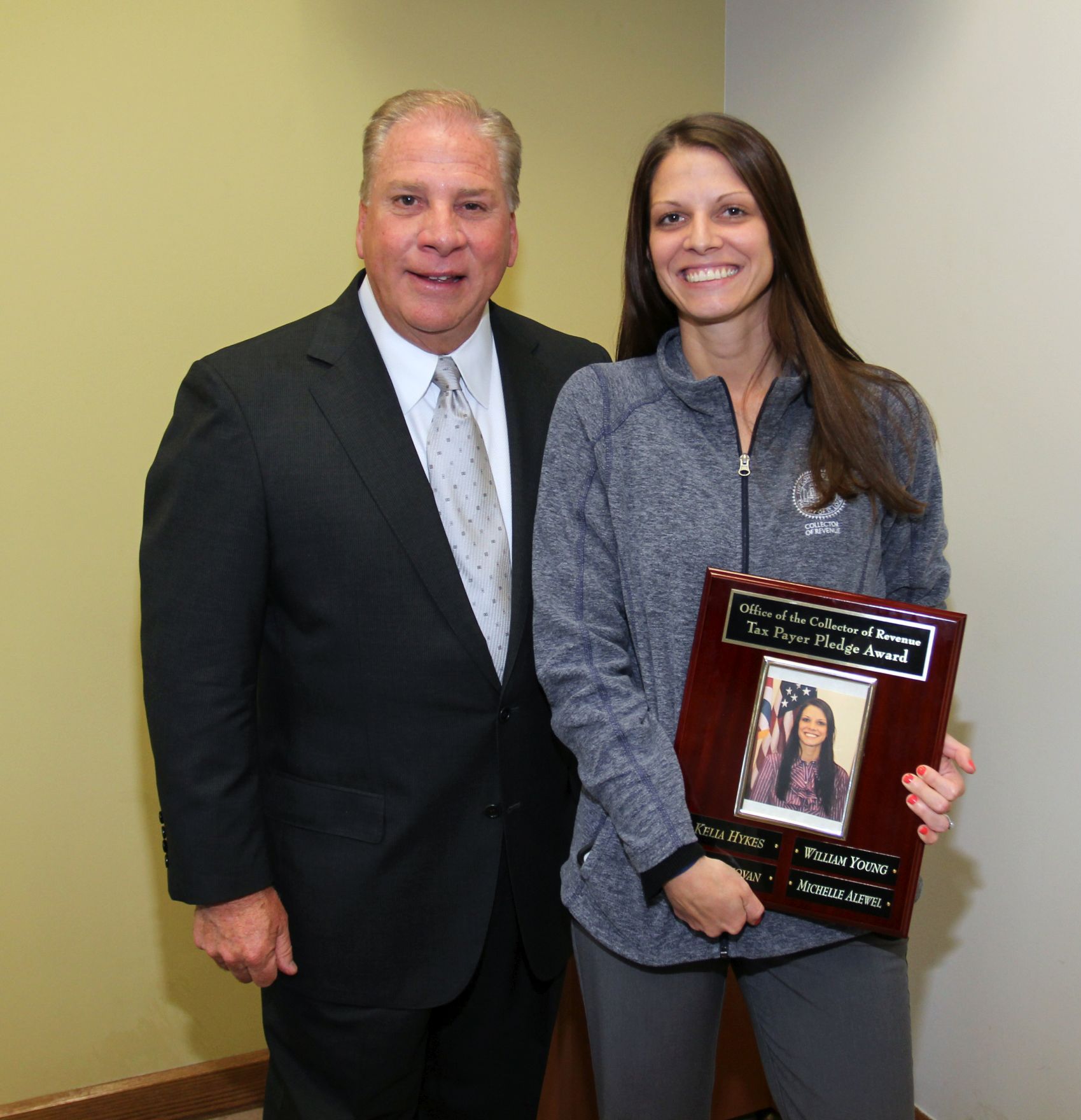 Pictured from Left:  Collector of Revenue Gregory F.X. Daly and Ms. Alewel