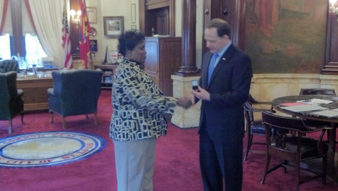Margaret Johnson receives her 40-year service pin from Mayor Francis G. Slay