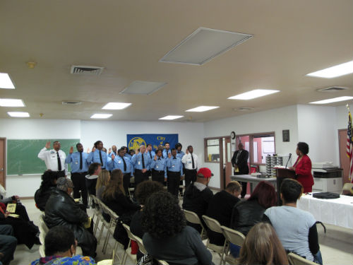 City Register Parrie May (r) administers the Oath of Office to the new CO Is and IIs on Dec. 19, 2014.