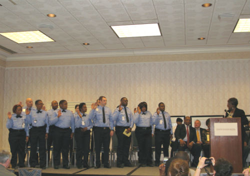 Parrie May gives the Oath of Office to the City's newest Correctional Officers on Friday, March 21, 2014.