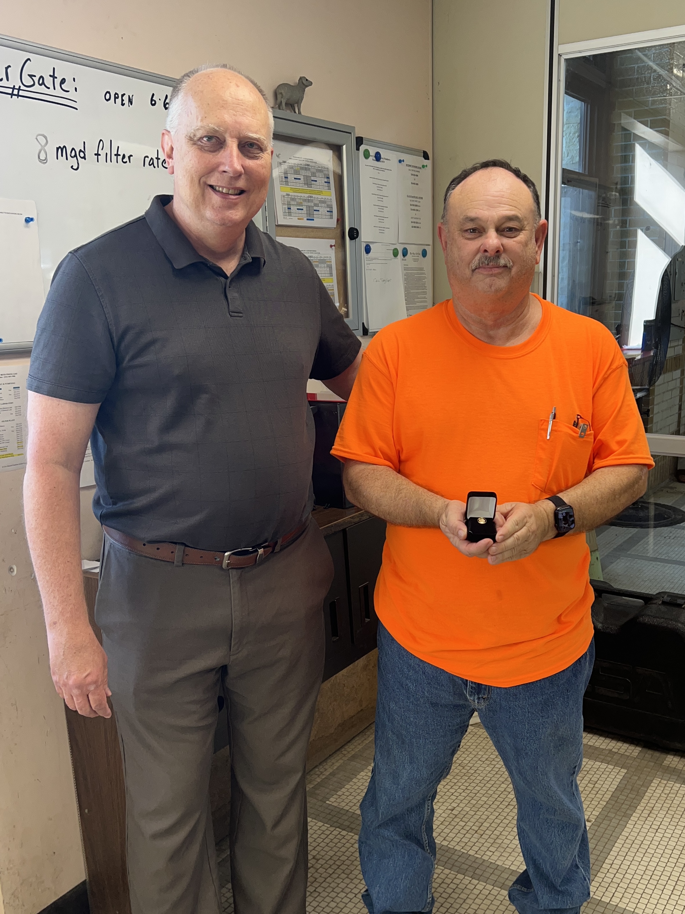 Director of Public Utilities Curtis B. Skouby, P.E., presents a 40-year service pin to Rick Mattingly